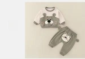Close-up of baby tiger romper set with cute embroidered details and soft cotton fabric