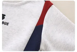 Detail of baby cotton sweatshirt featuring gray knit texture and BUE letter print