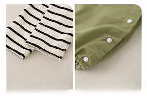 Detail of striped cotton cuffs and crotch snap buttons on newborn baby romper