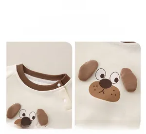 Detail of baby sweatshirt with shoulder snap buttons and 3D ear cartoon puppy design