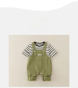 Detail view of cotton striped T-shirt and green overalls with easy-snap buttons for babies