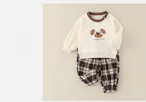 Detail of baby cotton set with 3D cartoon dog print and cozy plaid pants for spring