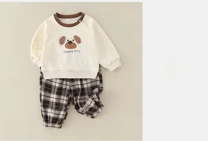 Close-up of baby long sleeve loungewear set with cute puppy embroidery and plaid pants