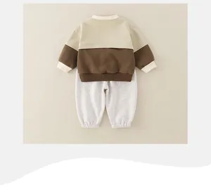 Rear view detail of soft cotton baby boy set with color-block sweatshirt and joggers