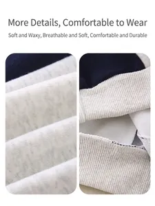 Navy and beige knit baby outfit featuring soft brushed cotton fabric and ribbed cuffs