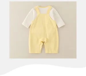 Rear view of infant cotton long-sleeved bodysuit with yellow overall strap details