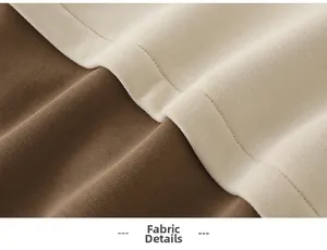 Detailed view of soft cotton knit fabric with beige and brown contrast stitching