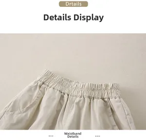 Close-up of elastic waistband and stitching on beige cotton baby casual pants