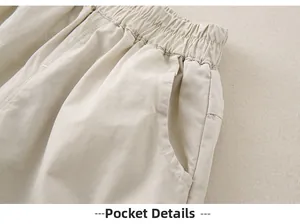 Detail view of elastic waistband and pocket on cotton baby girl leisure pants