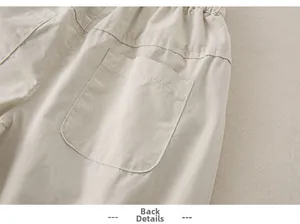 Close-up of baby girl cotton pants showing elastic waistband and back pocket detail
