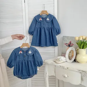 Detail of cute bunny and dog embroidery on the peter pan collar of denim dresses