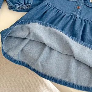 Blue denim long sleeve girl's dress with cute cartoon embroidery and ruffled waistline
