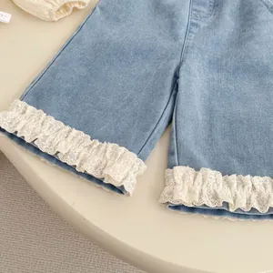 Girls light blue denim shorts featuring sweet white lace trim hem for summer daily wear