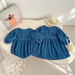 Detail of denim dress and romper featuring sailor collars with cute rabbit ear designs
