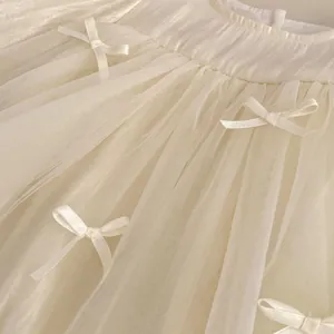 Elegant cream tulle dress for girls with delicate satin bows and tiered mesh skirt