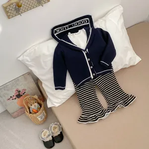 Detailed knit cardigan with hood lettering and striped flare pants for girls outfit