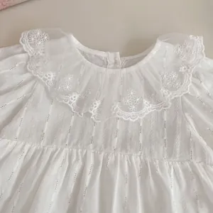 White long-sleeve baby bodysuit with delicate lace collar and floral embroidery