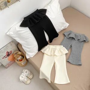 Leggings a zampa in cotone per bambina con vita a volant in nero, grigio e beige