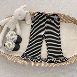 Detail of girls striped flared pants with ruffle hem and soft elastic waistband