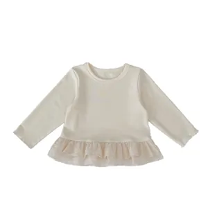 Girl's long sleeve cream knit top featuring delicate lace hem and embroidery details