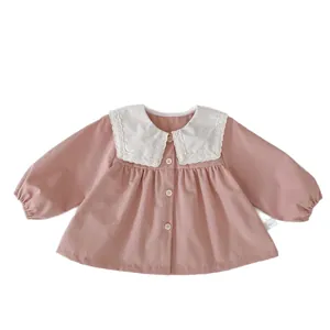 Pink cotton baby girl blouse with a white lace Peter Pan collar and button front detail