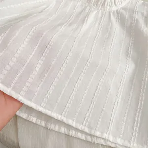 White toddler girl outfit set with vertical striped jacquard texture and ruffled collar