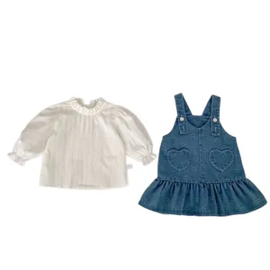 Toddler girl set featuring a white ruffle collar shirt and heart print denim overall dress