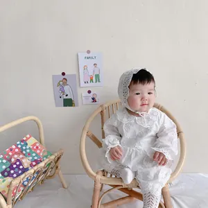 Infant white lace bodysuit with flower embroidery and matching bonnet for baby girls