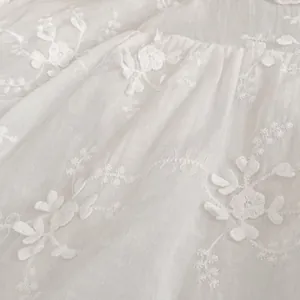 Elegant white baby girl princess dress with delicate floral embroidery and jacquard fabric
