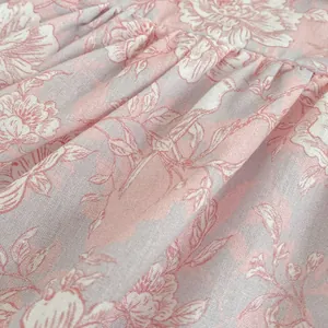 Pagliaccetto floreale neonata con stampe rosa e dettagli in cotone testurizzato