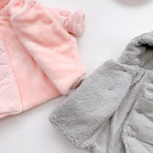 Detail of soft plush baby winter jacket lining with quilted texture and ribbed cuffs
