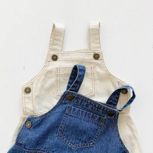 Infant denim overalls in beige and classic blue with vintage metal buckles and pockets