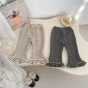 Girls striped flare knit pants with ruffle hem in French minimalist style