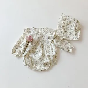 Detailed view of floral long sleeve baby bodysuit set with lace ruffles and matching hat