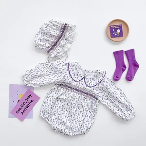 Baby floral long sleeve bodysuit with smocking detail, matching hat and purple socks set