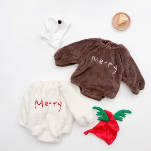 Detailed view of plush coral fleece baby rompers with Merry embroidery for Christmas