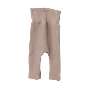 Infant ribbed knit high-waisted leggings in soft dusty pink color for newborns