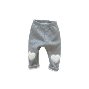Winter fleece-lined baby leggings in grey with white plush heart patches and elastic waist