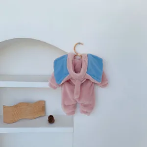 Detail of pink fleece baby romper with soft elephant hood and wooden button accents