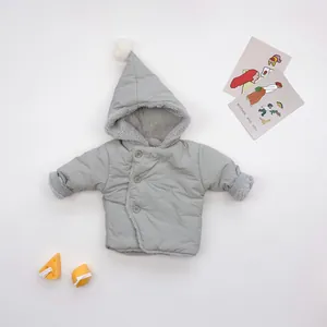 Light gray hooded baby winter coat with pom-pom and warm fleece lining on flat lay background