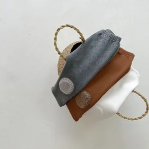Three-pack of warm fleece-lined baby cotton leggings in grey, brown, and white colors