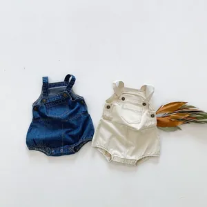 Infant denim and cream cotton rompers with adjustable straps and snap buttons for babies