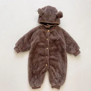 Detail of baby winter jumpsuit showing warm polar fleece fabric and cute bear ears