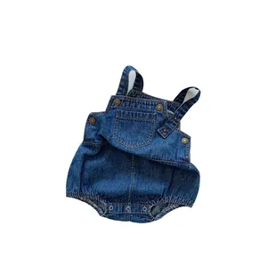 Dark blue denim baby bodysuit with utility buckles and functional front pocket