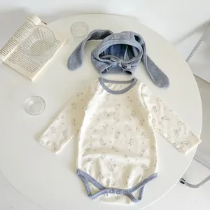 Detailed view of baby bunny print bodysuit with matching long rabbit ear bonnet set