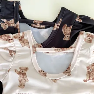 Detail of ruffled sleeves and cute bear prints on kids backless one-piece swimwear