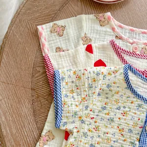 Detailed view of baby t-shirts in soft double gauze cotton with bear and floral prints