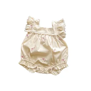 Cute cotton baby bodysuit with floral embroidery and lace ruffles in cream white