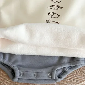Thick winter baby dinosaur romper with warm fleece lining and snap buttons at the bottom