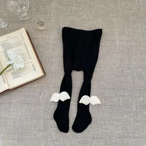 Infant ribbed knit leggings in black featuring cute white 3D angel wing decorations